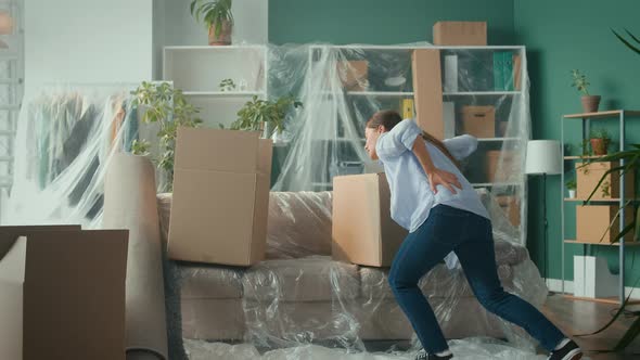 Woman Feels Sudden Back Pain When Carry Big Carton Box