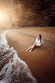 sexy woman relaxing on deserted beach at sunset - PhotoDune Item for Sale