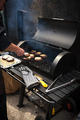 man cooking marbled meat on barbecue for burgers - PhotoDune Item for Sale