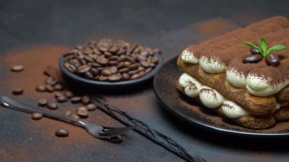 Classic Tiramisu Dessert on Ceramic Plate on Concrete Background