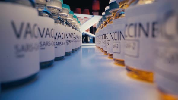 SARSCoV2 Drug Vaccine Vials Standing in a Row on Table Close Up