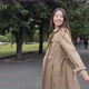 Asian Girl Playfully Whirls and Straightens Her Hair in the Park - VideoHive Item for Sale