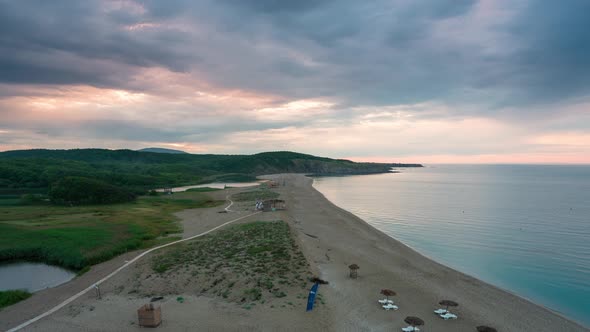 Time lapse with an empty wild beach at sunset.