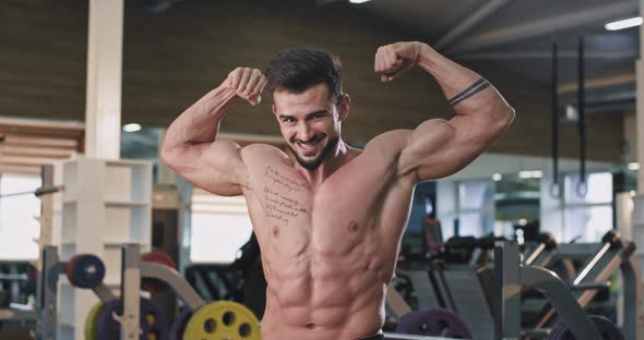 Happy Smiling Fit Man in the Gym After the Workout