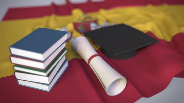 Graduation Cap and Diploma on the Spanish Flag alt