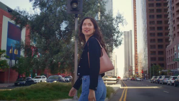 Young Businesswoman Crossing City Street