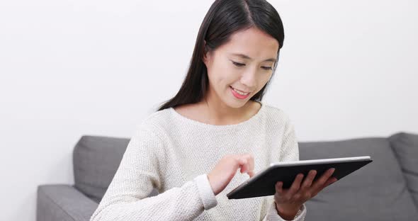 Woman read on tablet computer