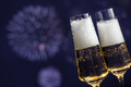 Pair of glasses of sparkling wine against fireworks - PhotoDune Item for Sale