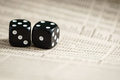A pair of dice on stock listings - PhotoDune Item for Sale
