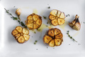 Roasted garlic with thyme and oil above - PhotoDune Item for Sale