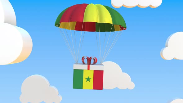 Box with National Flag of Senegal Falls with a Parachute