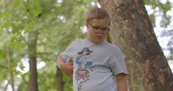 Down Syndrome Boy Portrait City Park Trees It Moves Body Psychic Reflection