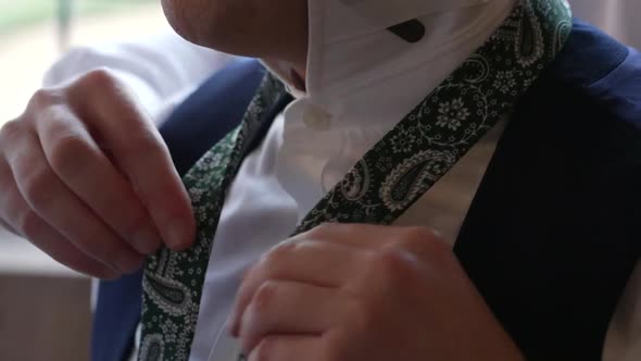 Closeup View of Young Male Hands Getting Dressed at Morning Wedding