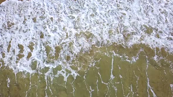 Raising Sand By Waves of the Transparent Water Becomes Muddy the View From the Top. Aerial Survey