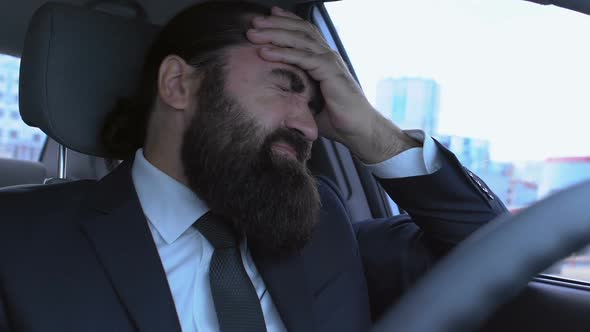 Pain Grimace on Male Face Suffering Headache in Car, Sad Man Feeling Helpless