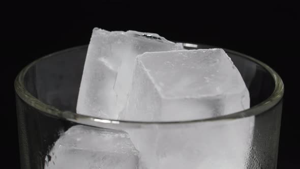 Ice Cubes in a Glass on a Black Background