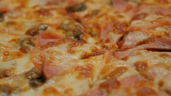 Bacon and chamignons spreaded on tasty baked pizza surface  panning 4K 2160p 30fps UHD video - Slow 
