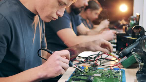 Technician Pours Some Soldering Acid To Chip Continue Soldering