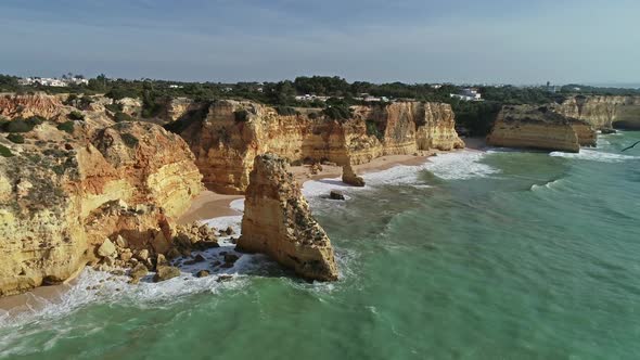 Aerial View on Cliffs Gulls and Waves in Algarve