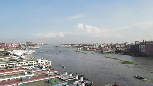 Rising aerial along passenger ferries at terminal area of busiest port of Dhaka i.e Sadarghat. Bangl