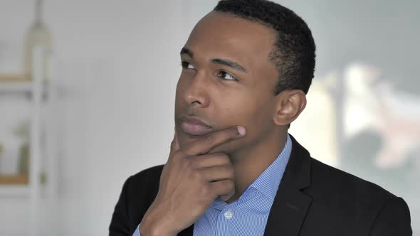 Portrait of Thinking Casual AfroAmerican Businessman New Plan