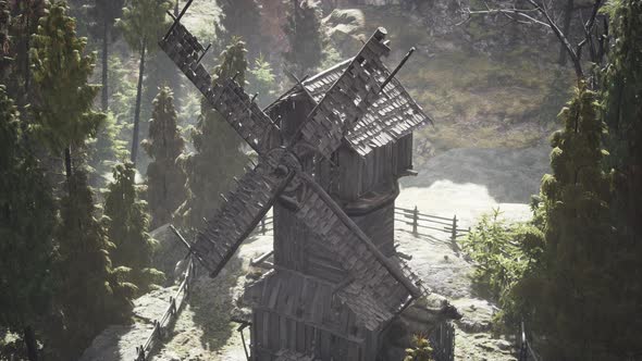 Old Traditional Wooden Windmill in the Forest alt
