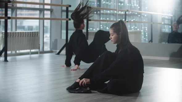 Little Girl Twins Preparing for the Dance Practice