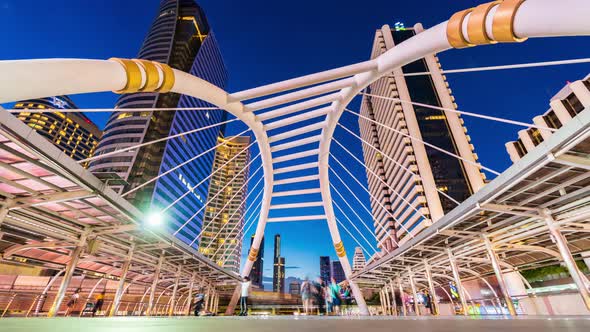 day to night time lapse of Chong Nonsi skytrain station in Bangkok,  Thailand