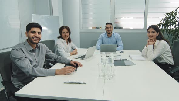 Diverse Executive Team Make Conference Video Call Looking at Camera Four Business People Group