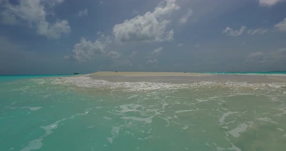 Natural flying tourism shot of a summer white paradise sand beach and blue ocean background in high 