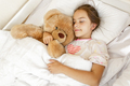 cute girl sleeping and hugging big teddy bear at bed - PhotoDune Item for Sale