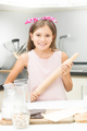 girl with pink bow on hair posing with wooden rolling pin - PhotoDune Item for Sale