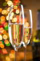 two glasses with champagne against sparkling Christmas tree - PhotoDune Item for Sale
