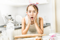 excited girl clapping on her cheeks with flour while cooking - PhotoDune Item for Sale