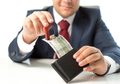Closeup of businessman stealing money from wallet with magnet - PhotoDune Item for Sale