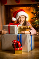 Portrait of smiling girl posing with Christmas presents - PhotoDune Item for Sale