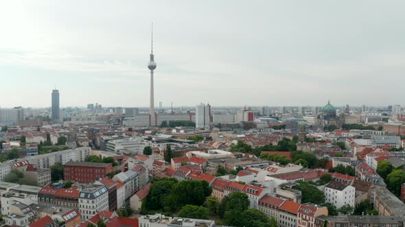 Aerial View of City Centre Descending Footage of Town Skyline with Tall Fernsehturm TV Tower