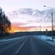 View Through the Windshield of a Moving Car on the Road in Winter and a Beautiful Sunrise in the Sky - VideoHive Item for Sale
