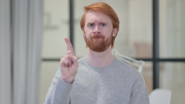 Portrait of No Sign By Young Redhead Man By Head Shake