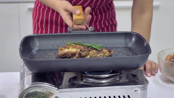 Young Asian woman cooking in kitchen at home. The wife is cooking a special meal for her husband.