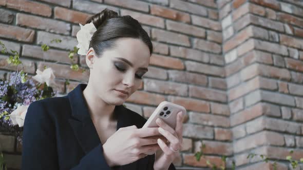 Young Woman Using Smart Phone Surfing Social Media Checking News