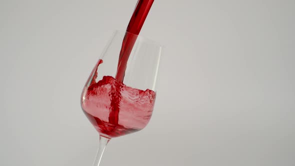 Pouring Red Wine in Tilted Glass at 1000 Fps Slow Motion