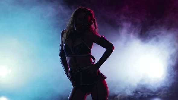 Stripper in Leather Clothes Performs Sexy Dance on Smoke Scene