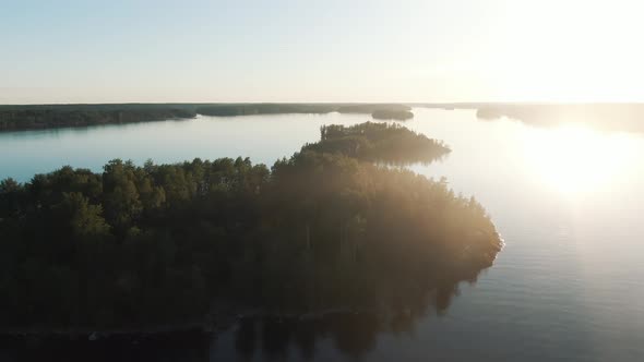 Aerial Flight Over the Islands on Lake on Summer Sunset, Pacifying Landscape of Calm Lake and Forest