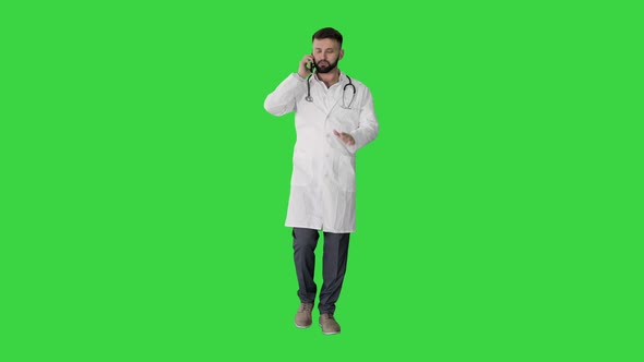 Medical Doctor Calling By Phone Walking on a Green Screen, Chroma Key