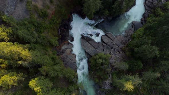 River flowing through green cliff 4k