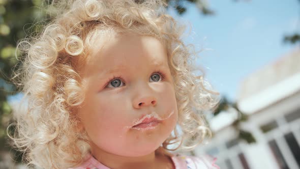 Portrait of a Funny Girl with Leftover Cream From a Cake