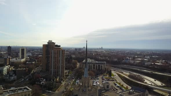 Aerial view of Minneapolis church surrounded by highways and cars passing by