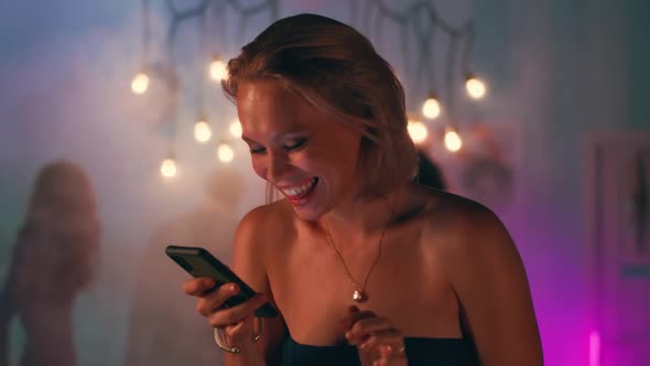 Woman Sending Voice Message During Party