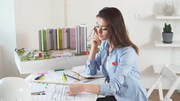 Confident Satisfied Smiling Brunette Woman Creating New Models of Building